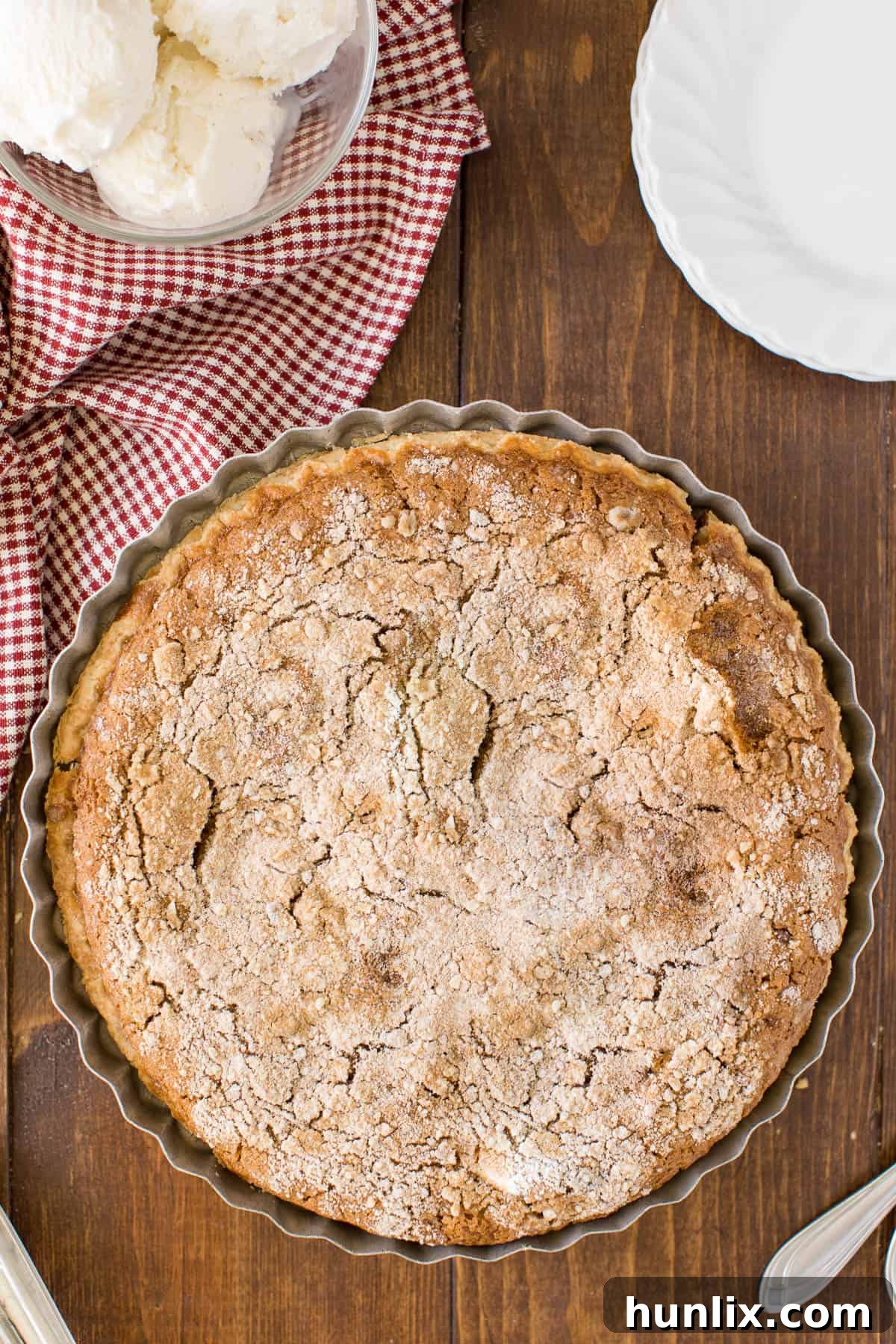 Classic Shoofly Pie, a Pennsylvania Dutch dessert, on a rustic wooden surface, perfect for any gathering.