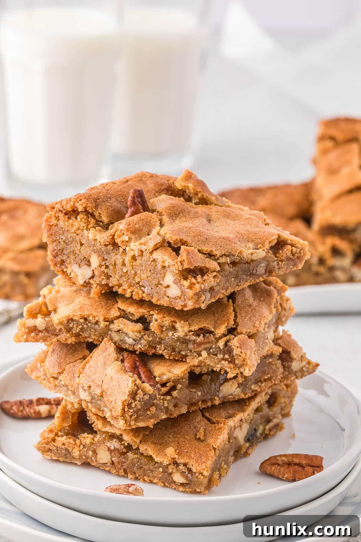 A beautifully arranged stack of butterscotch blondies, highlighting their golden hue and inviting texture.
