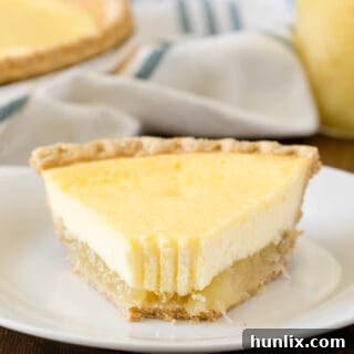 A slice of pie on a plate with a bite off the end.