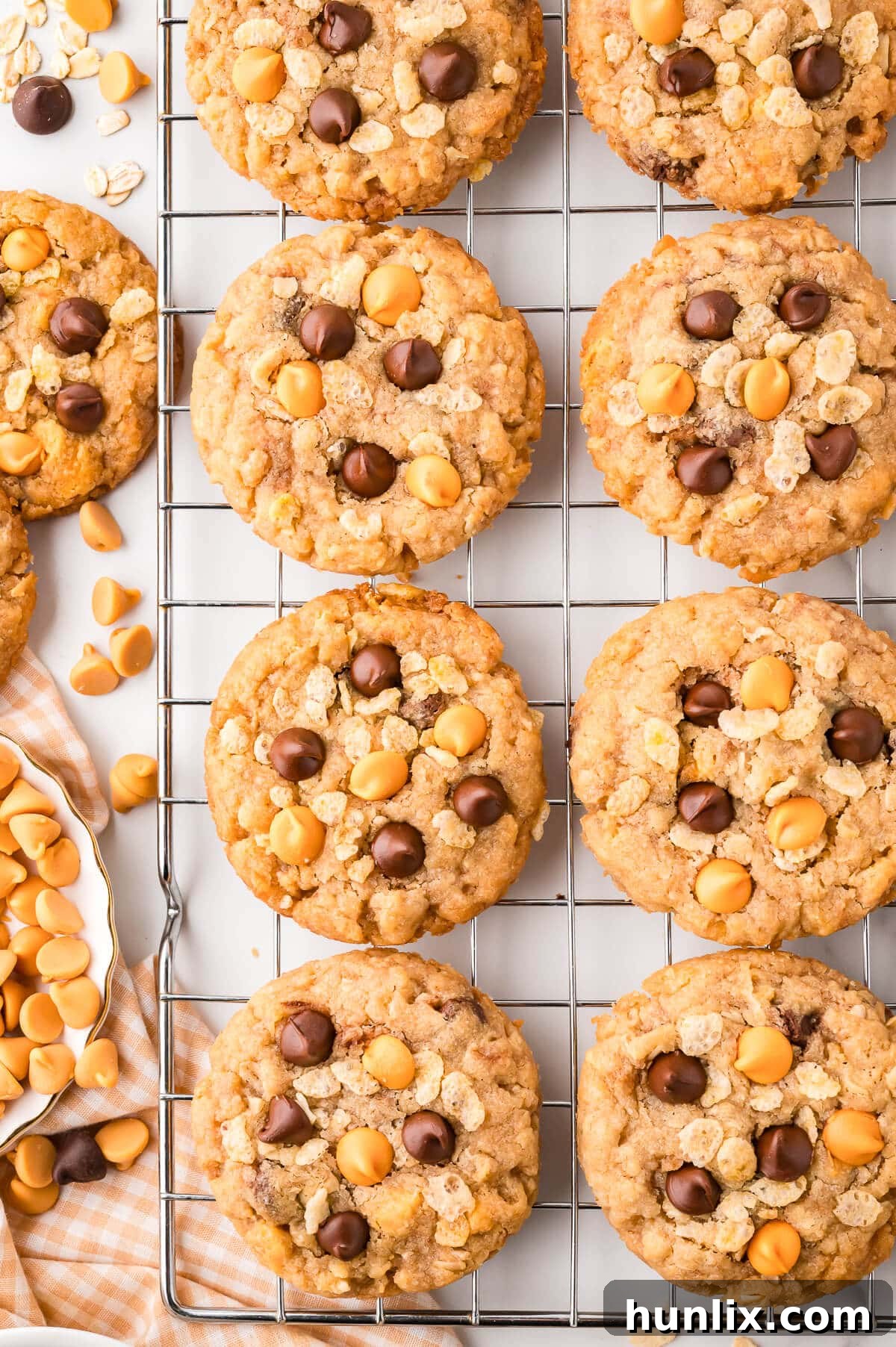 Freshly baked Rice Krispie cookies cooling on a wire rack, ready to be enjoyed.