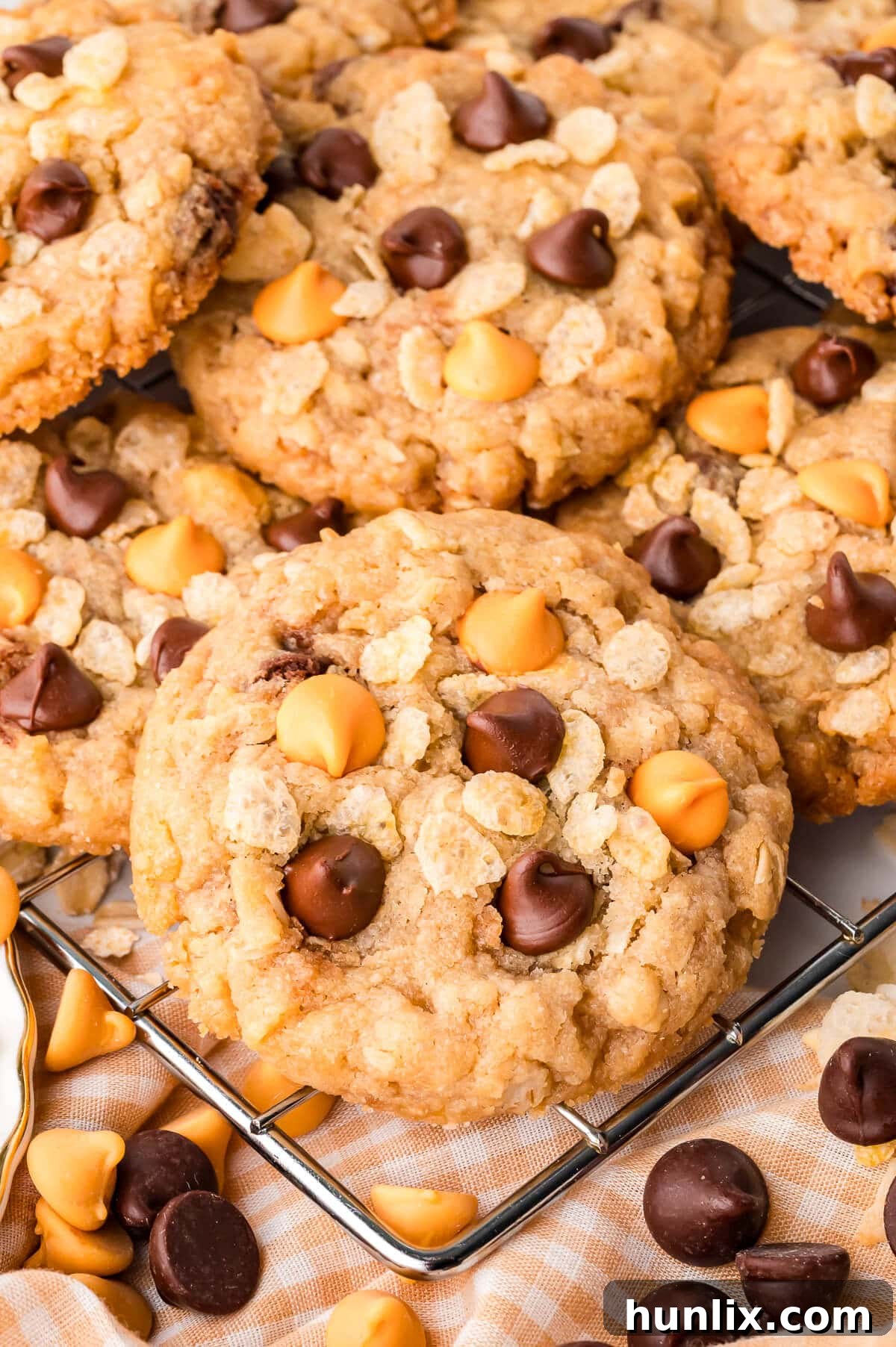 A freshly baked batch of crunchy Rice Krispie cookies arranged on a wire rack to cool down.
