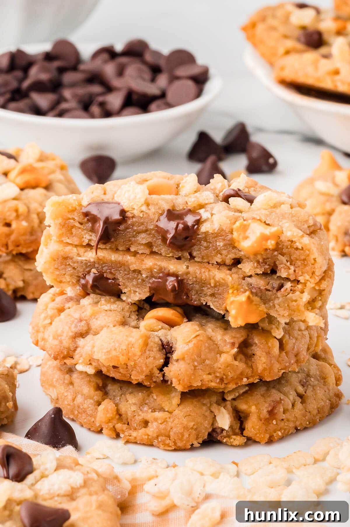 A stack of delicious Rice Krispie cookies, some with a bite taken out, revealing their crispy and chewy texture.