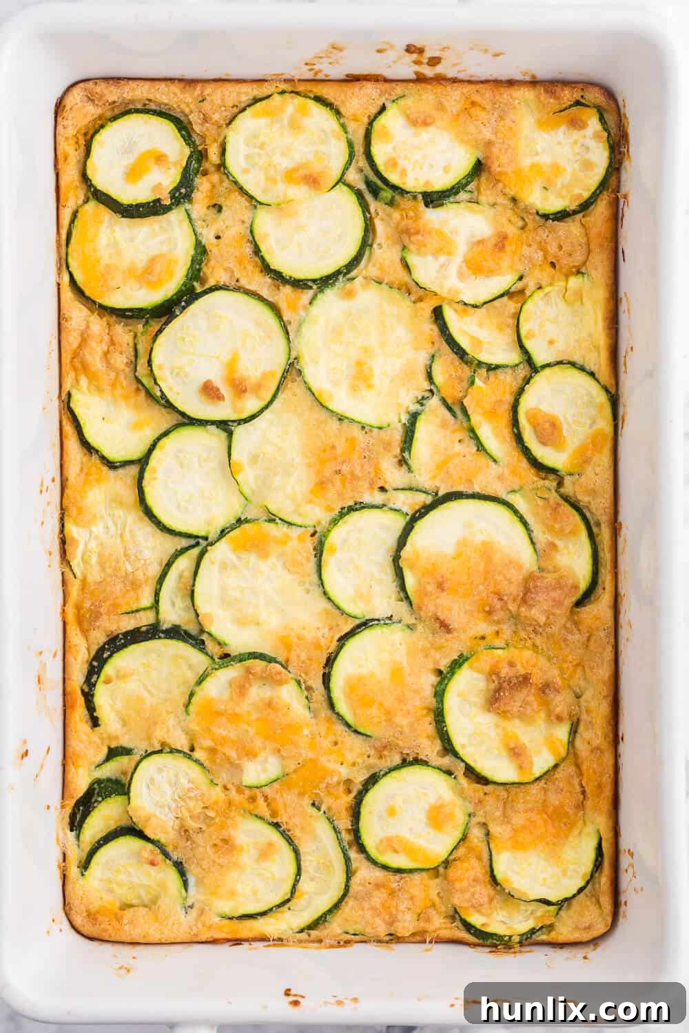 Golden Baked Zucchini 2 Baked Zucchini - An egg-based casserole with roasted zucchini slices and loads of cheese.