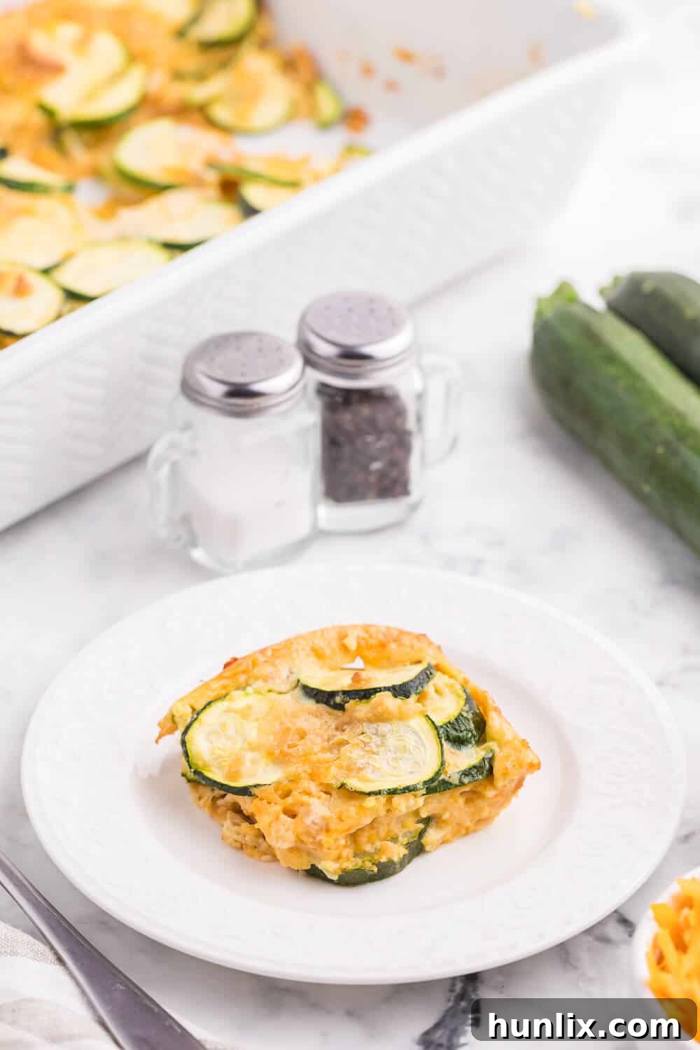 Golden Baked Zucchini 4 Baked Zucchini - An egg-based casserole with roasted zucchini slices, buttery crushed Ritz crackers and loads of cheese.