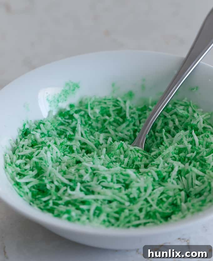 Krispie Easter Nests - This easy Easter dessert is fun to make and eat! Kids love to help decorate with colourful green grass and Easter chocolate and candy.