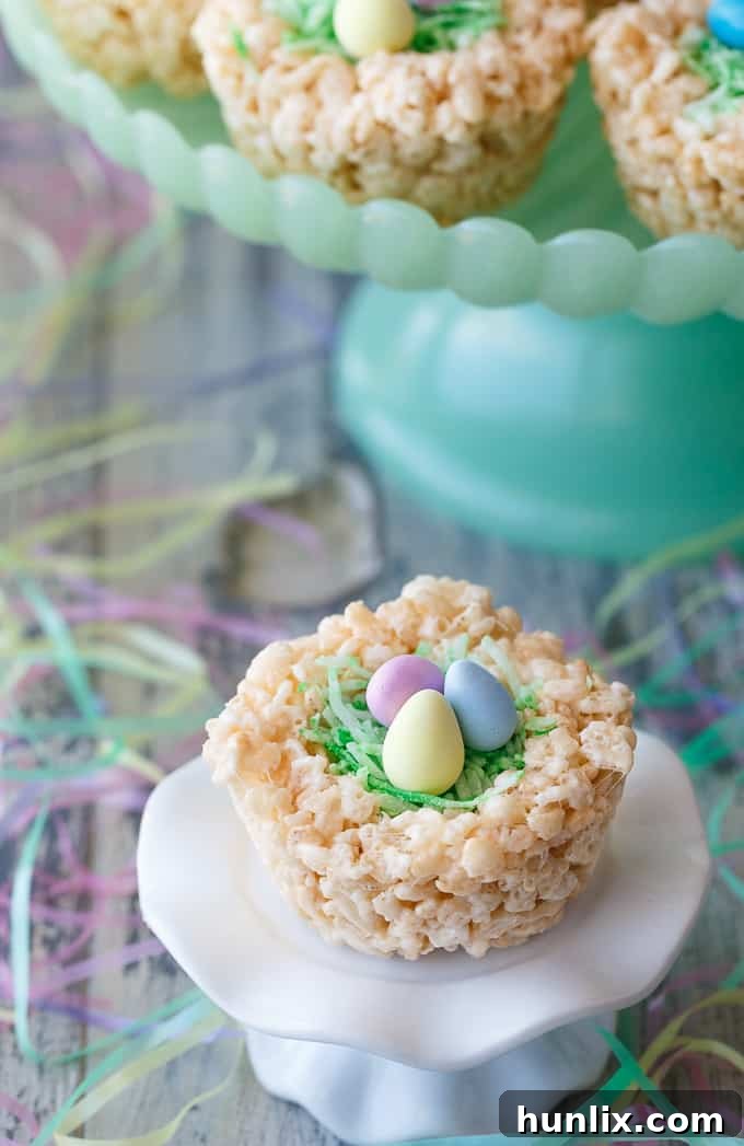 Krispie Easter Nests - This easy Easter dessert is fun to make and eat! Kids love to help decorate with colourful green grass and Easter chocolate and candy.