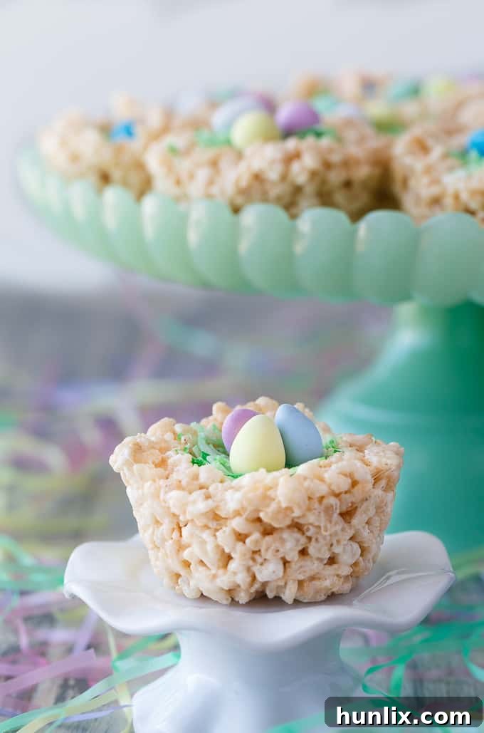 Krispie Easter Nests - This easy Easter dessert is fun to make and eat! Kids love to help decorate with colourful green grass and Easter chocolate and candy.