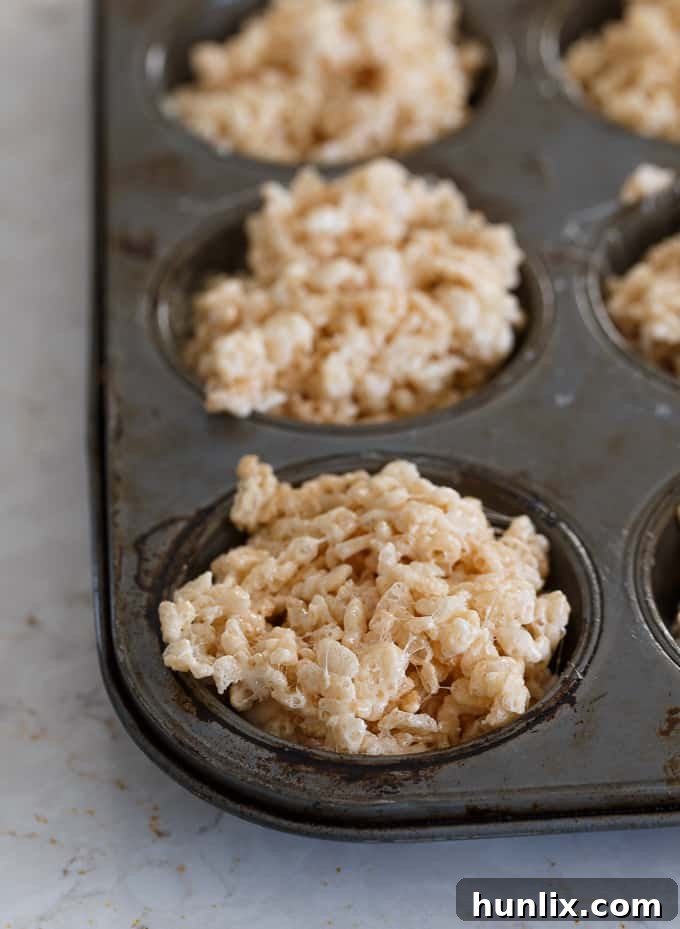 Krispie Easter Nests - This easy Easter dessert is fun to make and eat! Kids love to help decorate with colourful green grass and Easter chocolate and candy.