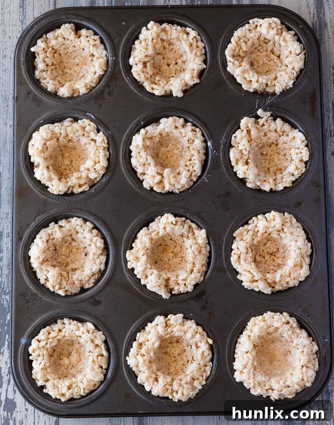 Krispie Easter Nests - This easy Easter dessert is fun to make and eat! Kids love to help decorate with colourful green grass and Easter chocolate and candy.