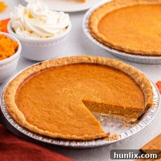 A beautifully presented sweet potato pie, garnished for the holidays.
