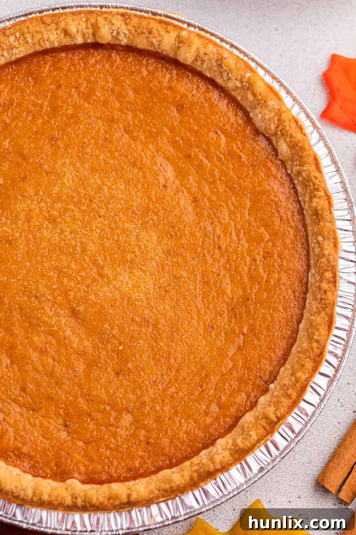 An inviting overhead shot of a freshly baked sweet potato pie, perfectly golden brown and ready to be served.