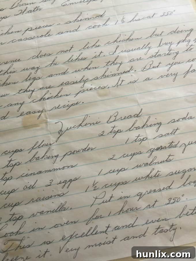 A handwritten recipe card, likely a treasured family heirloom, possibly for the zucchini bread.