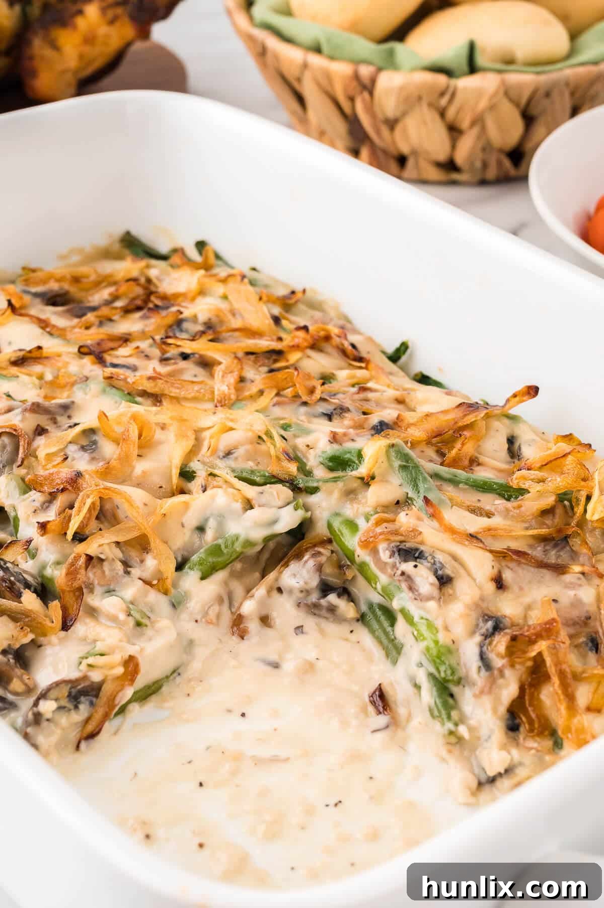 Homestyle Green Bean Bake 9 A slice of green bean casserole removed from the baking dish, revealing its layers and creamy interior.