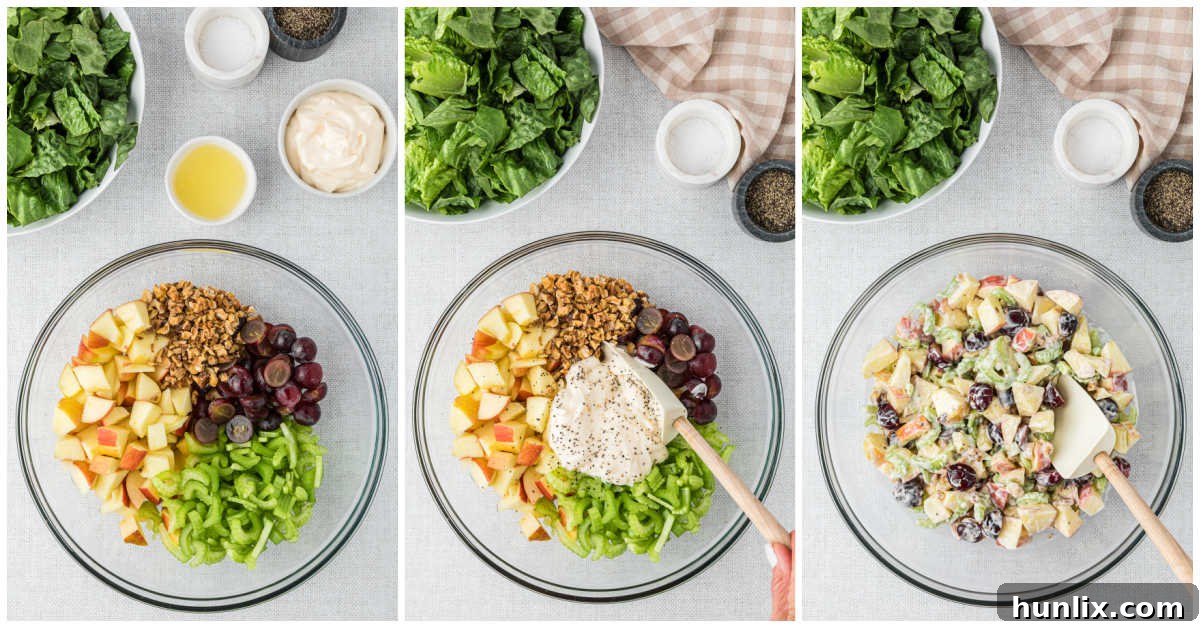 Close-up of apples, celery, grapes, and walnuts being mixed in a bowl, showing the initial stages of preparing Waldorf salad before the dressing is added.