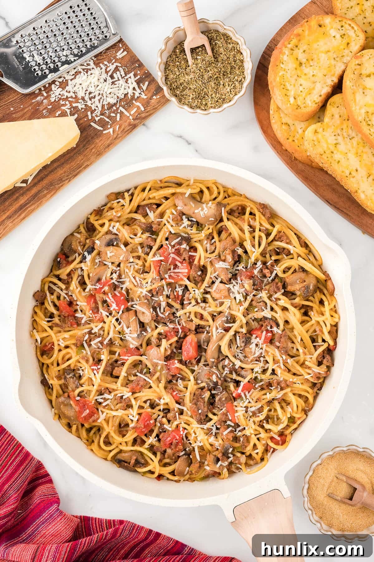 Easy Skillet Spaghetti 2 A vibrant One-Pan Spaghetti dish served directly in a white skillet.