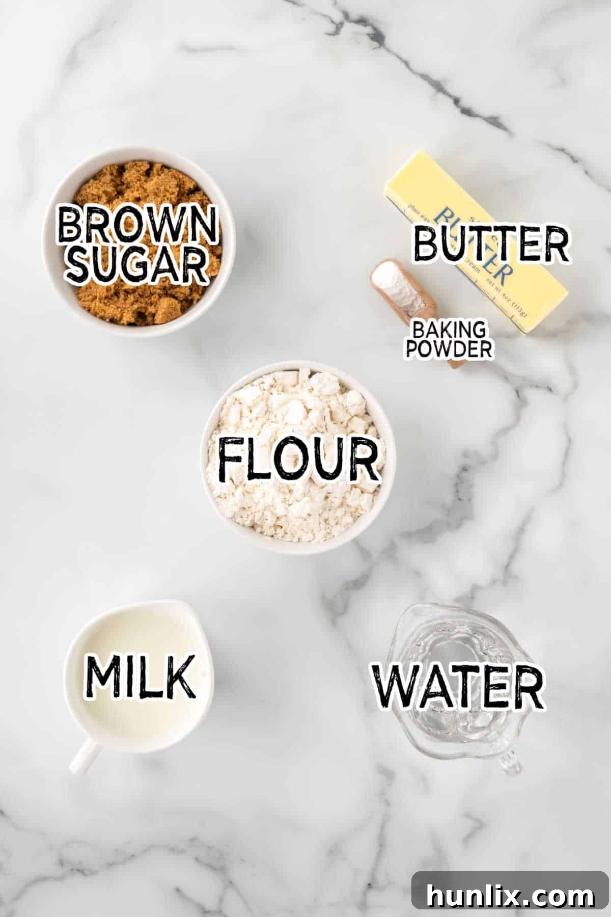 All the ingredients neatly laid out on a kitchen counter for making Half-Hour Pudding.