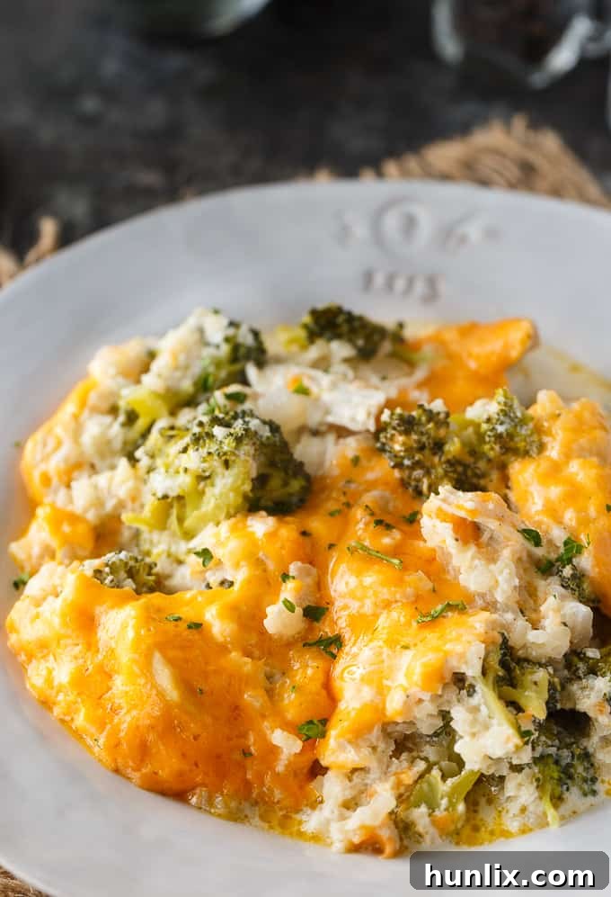 Keto Chicken Divan Bake 2 Delicious and creamy Low Carb Chicken Divan casserole with chicken, broccoli, cheddar cheese, and cauliflower rice, a perfect keto-friendly comfort food.