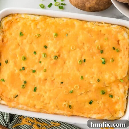 The recipe in a white pan, showing a golden brown top.