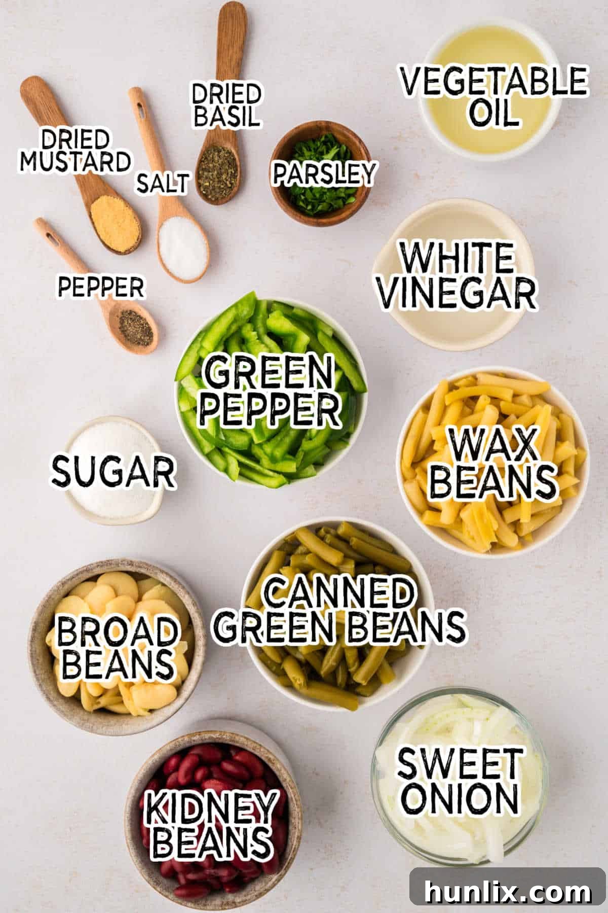 Vibrant Bean Medley 3 A vibrant selection of fresh and canned ingredients for bean salad laid out neatly on a clean white background, showcasing the quality produce.