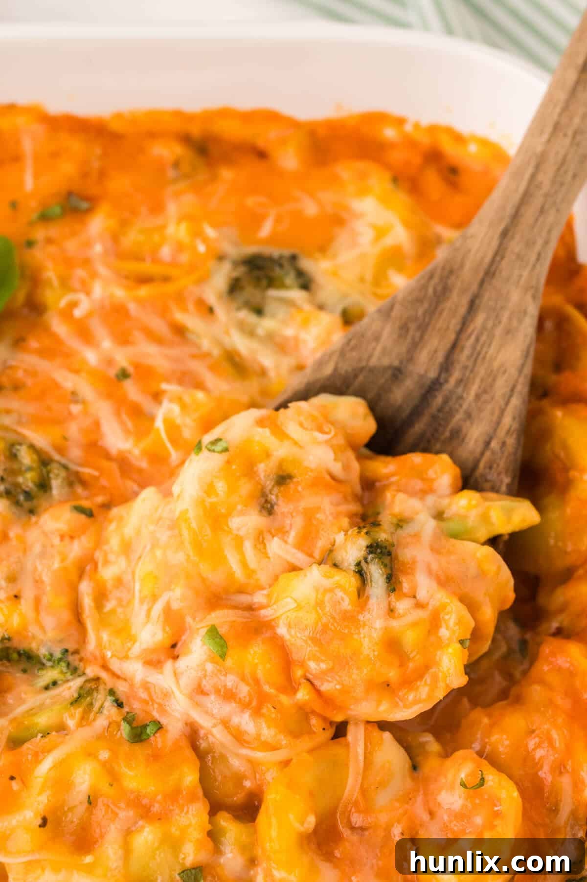 The recipe in a pan with a wooden spoon.