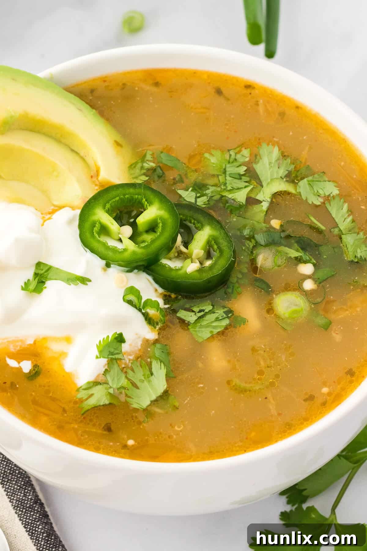 A simple yet inviting bowl of white chicken chili, showcasing its rich texture and subtle color, ready for a comforting meal.