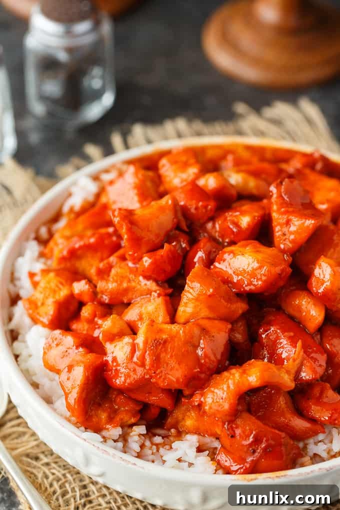 Russian Chicken - Sweet and tangy! This easy dinner recipe has a flavorful sauce made with Russian dressing, onion soup mix and apricot jam. Serve on a bed of rice for a delicious family meal.