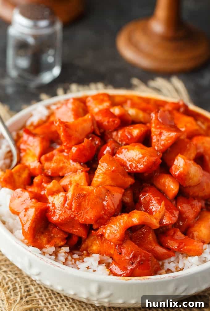 Russian Chicken - Sweet and tangy! This easy dinner recipe has a flavorful sauce made with Russian dressing, onion soup mix and apricot jam. Serve on a bed of rice for a delicious family meal.