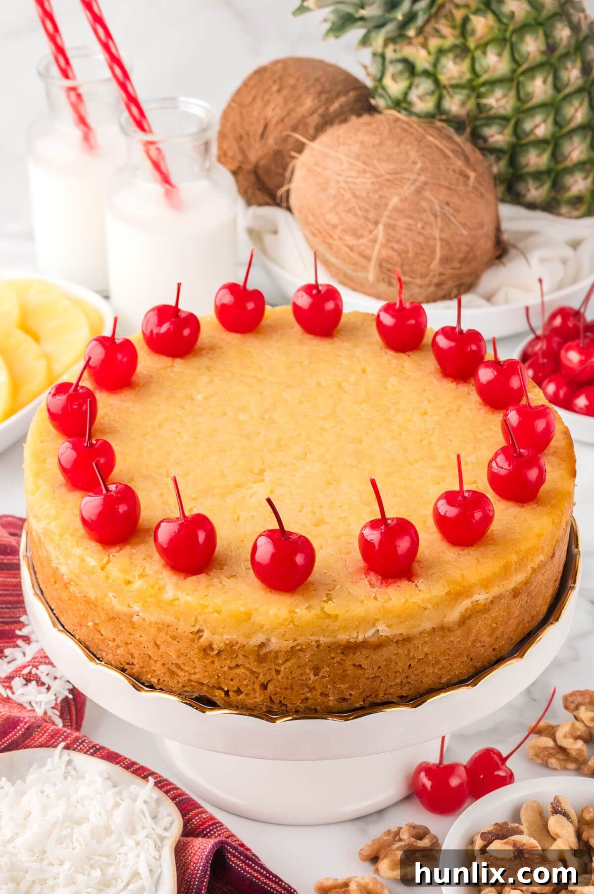 Golden, buttery Fool's Cake on a cake stand, ready to be served.