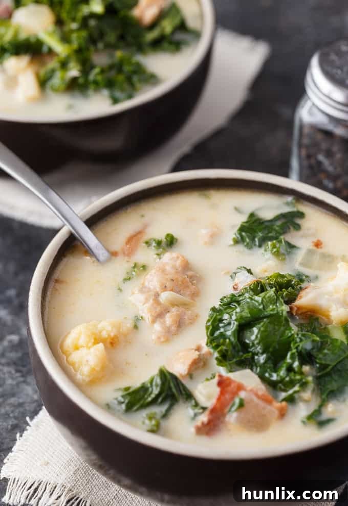 Creamy Keto Tuscan Sausage Soup 6 Keto Zuppa Toscana - A keto friendly version of the famous Tuscan soup! It's filled with kale, bacon, sausage, roasted cauliflower immersed in a creamy broth.
