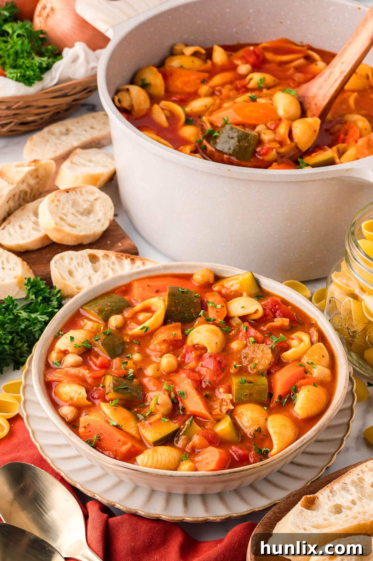 Hearty Italian Vegetable and Pasta Soup 6 A beautifully presented bowl of Minestrone Soup, garnished with fresh herbs and a drizzle of olive oil, ready to enjoy.