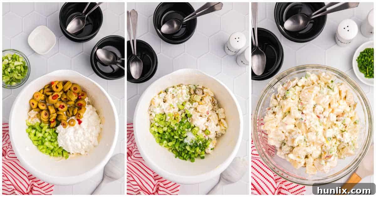 A close-up of cheese potato salad ingredients being mixed in a large bowl, showcasing the creamy texture and fresh additions.