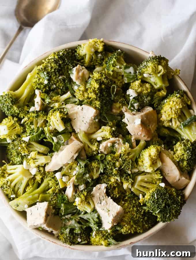 Chicken & Broccoli Salad with vibrant green onions and a rich dressing, perfect for a healthy and satisfying meal.