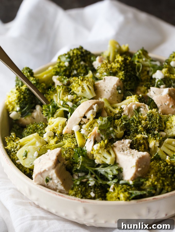 Close-up of Creamy Chicken & Broccoli Salad in a bowl, showing the rich dressing and fresh ingredients.