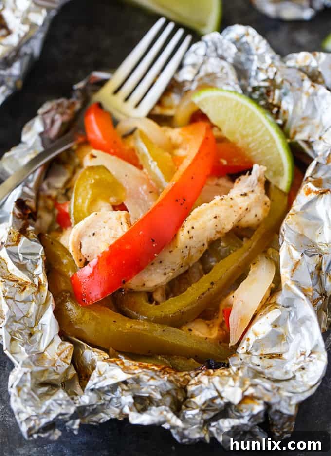 Zesty Chicken Fajita Foil Dinners 2 Flavor-packed and low-carb Chicken Fajita Foil Packets, an easy grilling recipe with tender chicken, colorful peppers, and savory onions.