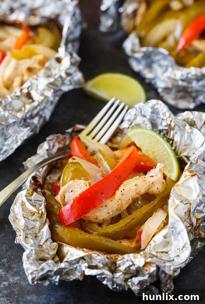 Zesty Chicken Fajita Foil Dinners 5 A sealed Chicken Fajita Foil Packet cooking on a hot grill, creating a delicious and easy meal.