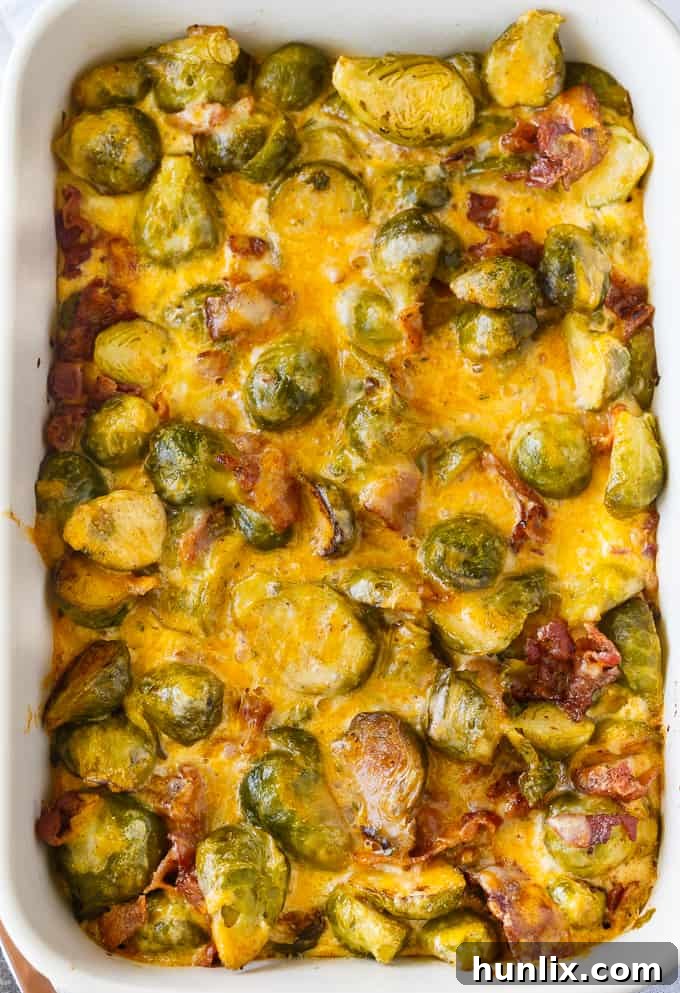 Close-up of a serving of Keto Brussels Sprouts Casserole, showcasing its creamy texture, bacon, and golden-brown top.