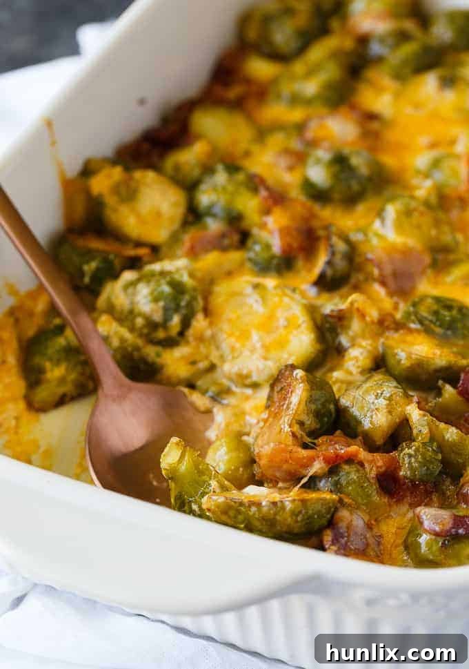 Freshly baked Keto Brussels Sprouts Casserole, bubbling with cheese and bacon, ready to be served.