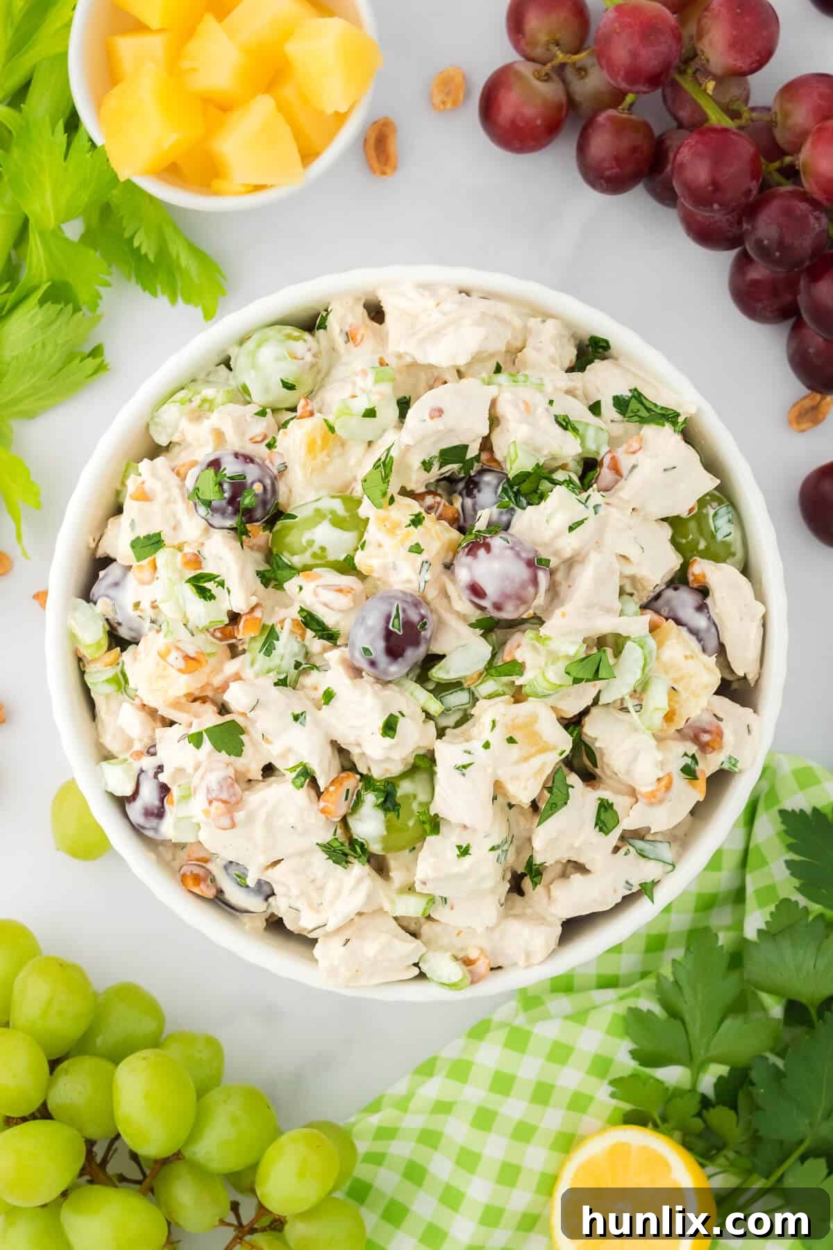 A beautifully presented bowl of chicken salad with grapes, ready to be served.