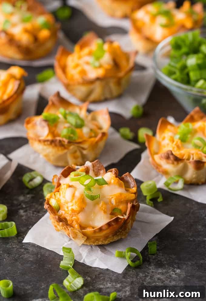 Crispy Buffalo Chicken Wonton Bites 2 Buffalo Chicken Wonton Cups - a crispy, savory appetizer perfect for any gathering.