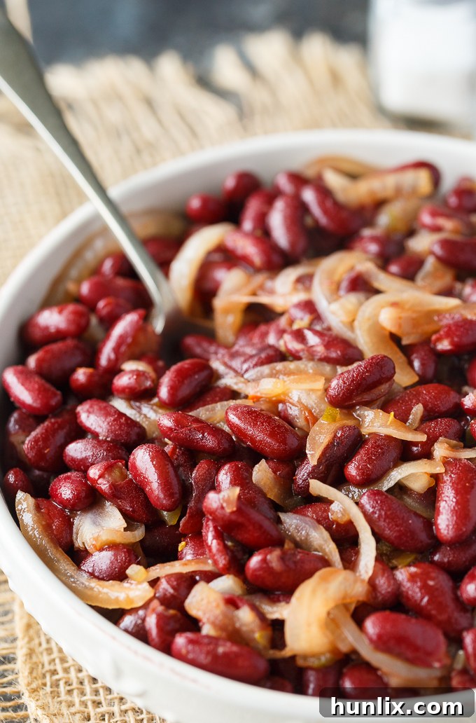 Oven-Baked Kidney Bean Delight 5 A freshly baked kidney bean casserole, bubbling hot from the oven, with melted butter dots on top, ready to be served.