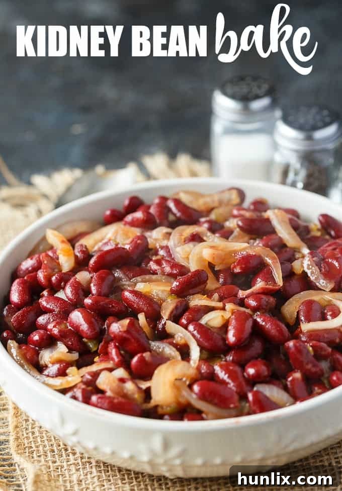 Oven-Baked Kidney Bean Delight 6 A serving of the kidney bean bake in a small white bowl, garnished with fresh parsley, ready to be enjoyed as a side dish.