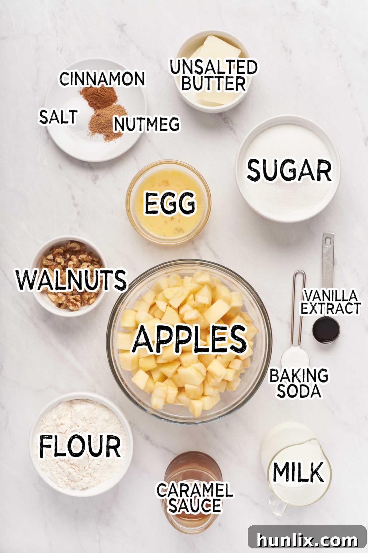 A collection of ingredients laid out on a kitchen counter, ready for Nobby Apple Cake preparation.