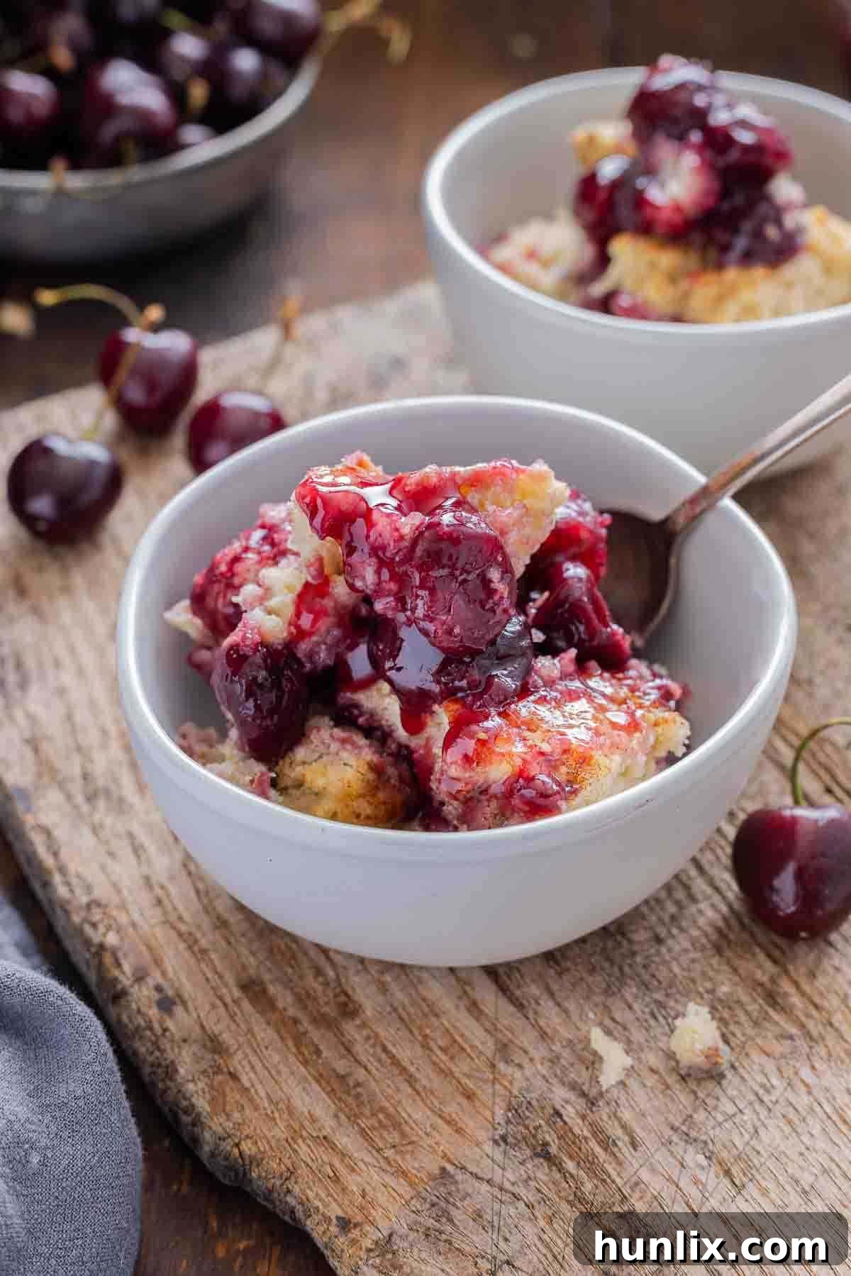 Fireside Cherry Cobbler 6 A bowl of the recipe with a spoon.