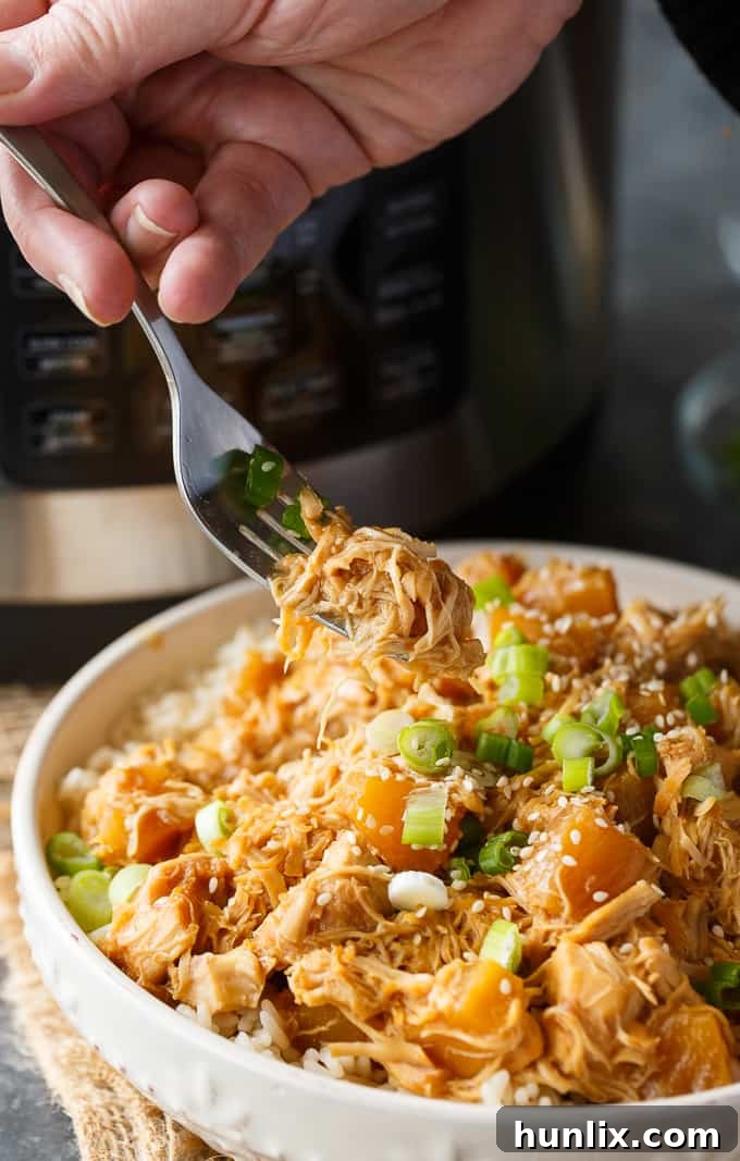 Pineapple Teriyaki Chicken - The easiest Asian-inspired pressure cooker recipe! Tender, juicy shredded chicken cooks to perfection in a sweet and savory homemade teriyaki sauce.