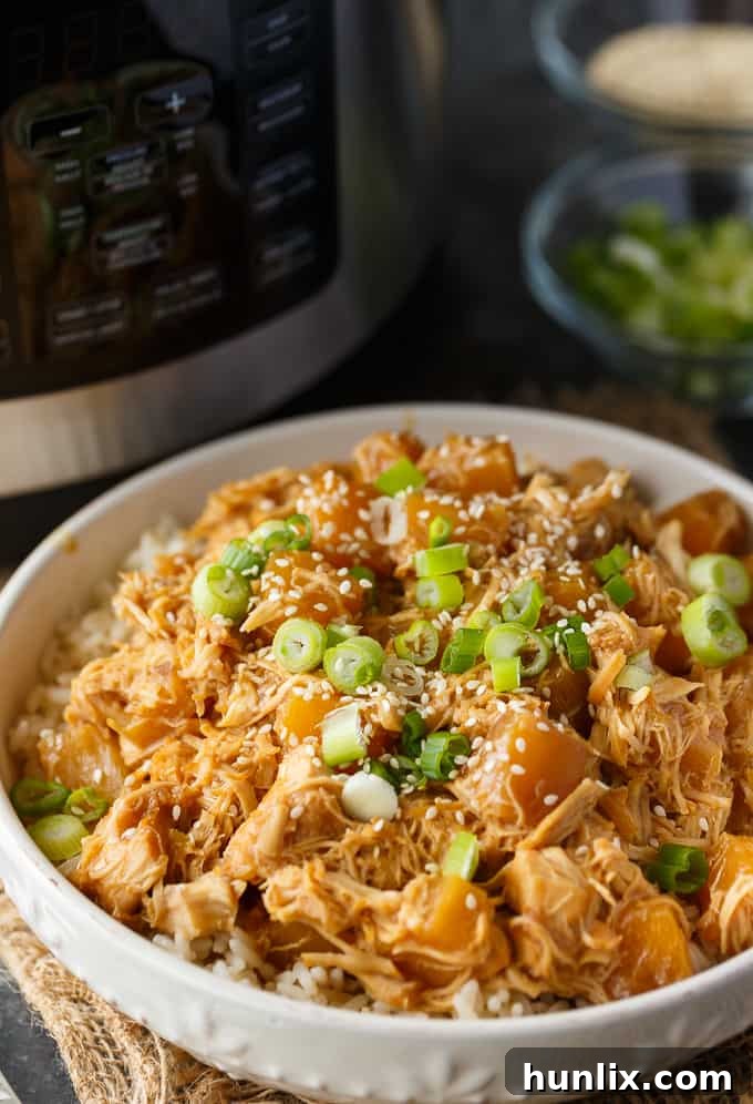 Pineapple Teriyaki Chicken - The easiest Asian-inspired pressure cooker recipe! Tender, juicy shredded chicken cooks to perfection in a sweet and savory homemade teriyaki sauce.