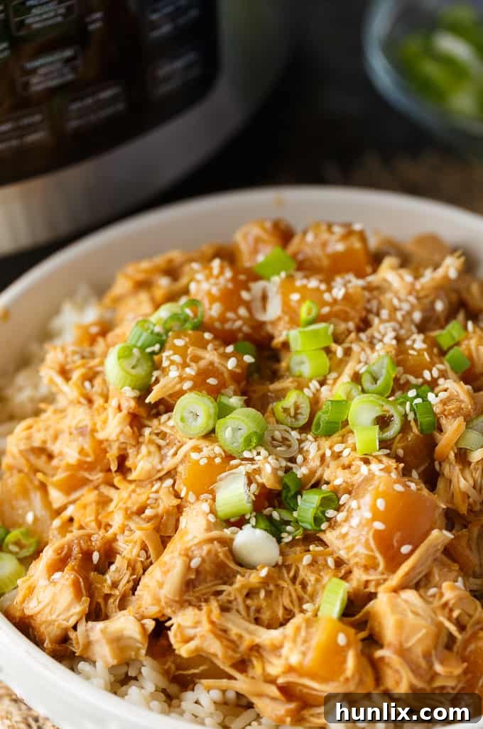Pineapple Teriyaki Chicken - The easiest Asian-inspired pressure cooker recipe! Tender, juicy shredded chicken cooks to perfection in a sweet and savory homemade teriyaki sauce.