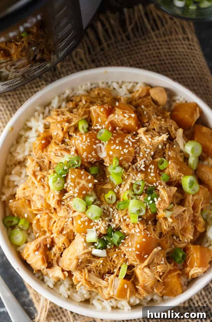 Pineapple Teriyaki Chicken - The easiest Asian-inspired pressure cooker recipe! Tender, juicy shredded chicken cooks to perfection in a sweet and savory homemade teriyaki sauce.