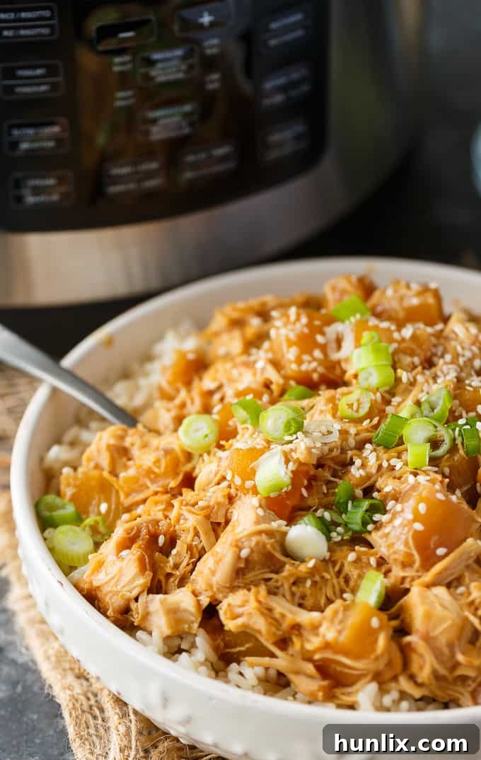 Pineapple Teriyaki Chicken - The easiest Asian-inspired pressure cooker recipe! Tender, juicy shredded chicken cooks to perfection in a sweet and savory homemade teriyaki sauce.