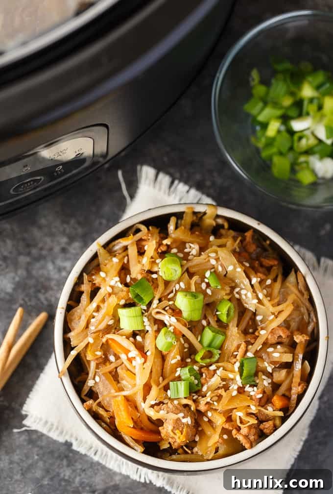 Egg Roll in a Bowl being served directly from the Crock-Pot, demonstrating the ease of the Cook & Carry feature.