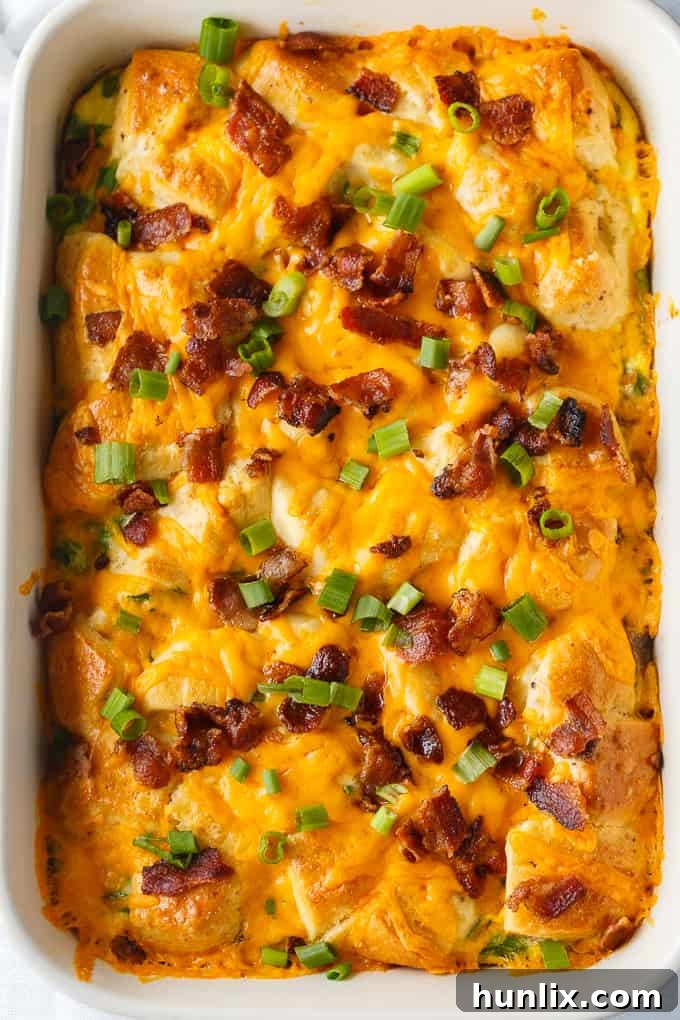 A large pan of Bacon and Egg Biscuit Casserole, ready to be served for a family breakfast.